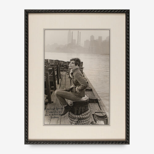 photo of Hepburn perched on a dock, signed and inscribed in black felt tip "Darling George, I worship and adore you, Audrey."