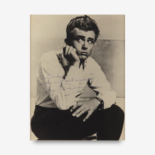 Incredible vintage semi-glossy 9.5 x 12.5 photo of Dean on the set of East of Eden, signed and inscribed in purple fountain pen, "To Cindy, With my best wishes, James Dean."