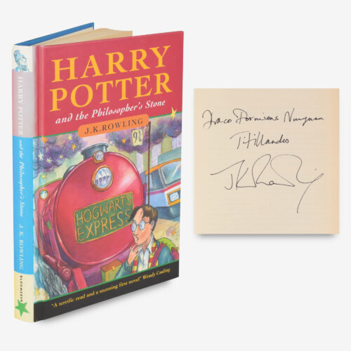 Extremely rare second printing inscribed with the Hogwarts motto, "Draco Dormiens Nunquam Titillandus, J. K. Rowling"