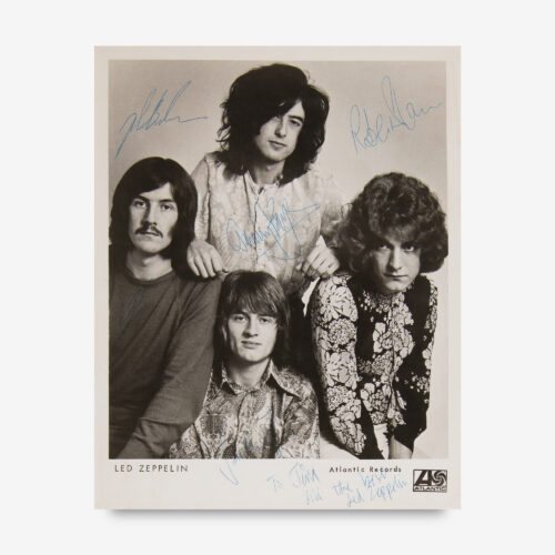 Exceptionally rare vintage glossy 8 x 10 Atlantic Records publicity photo of Led Zeppelin, signed in blue ballpoint by Robert Plant, John Bonham, John Paul Jones, and Jimmy Page, who adds an inscription to the lower border: “To Jim, All the best, Led Zeppelin.”